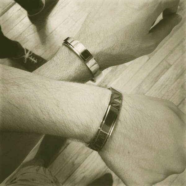 Image of Caption: Christian Siriano and Brad Walsh exchanged engagement bracelets, designed by David Hart