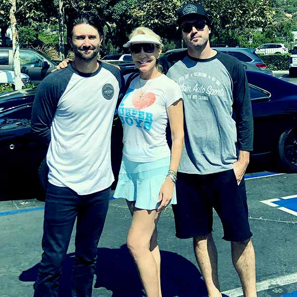 Image of Caption: Linda Thompson with her two sons; Brandon and Brody went out after playing tennis