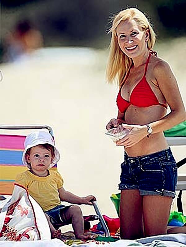 Caption: Baby Isabel with Mother Angela on the Beach.